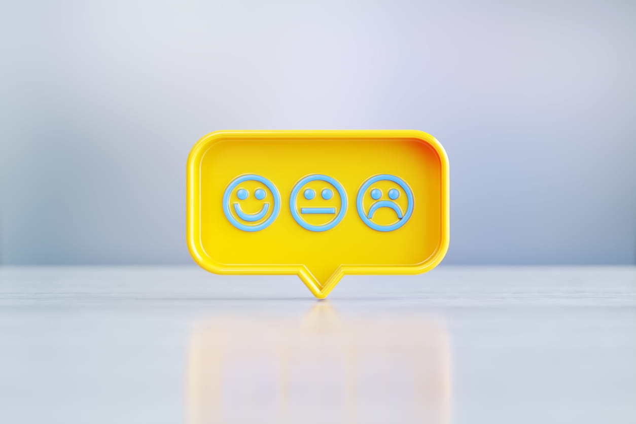 Speech bubble showing happy sad faces